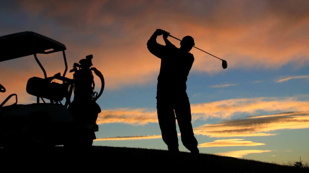 silhouette of golfer